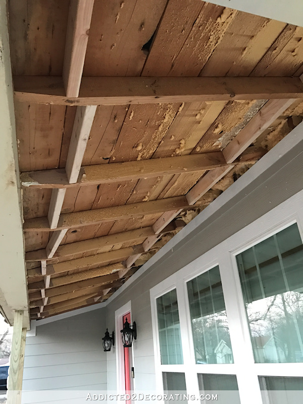 Front porch ceiling with exposed rafters before pine tongue and groove boards were installed