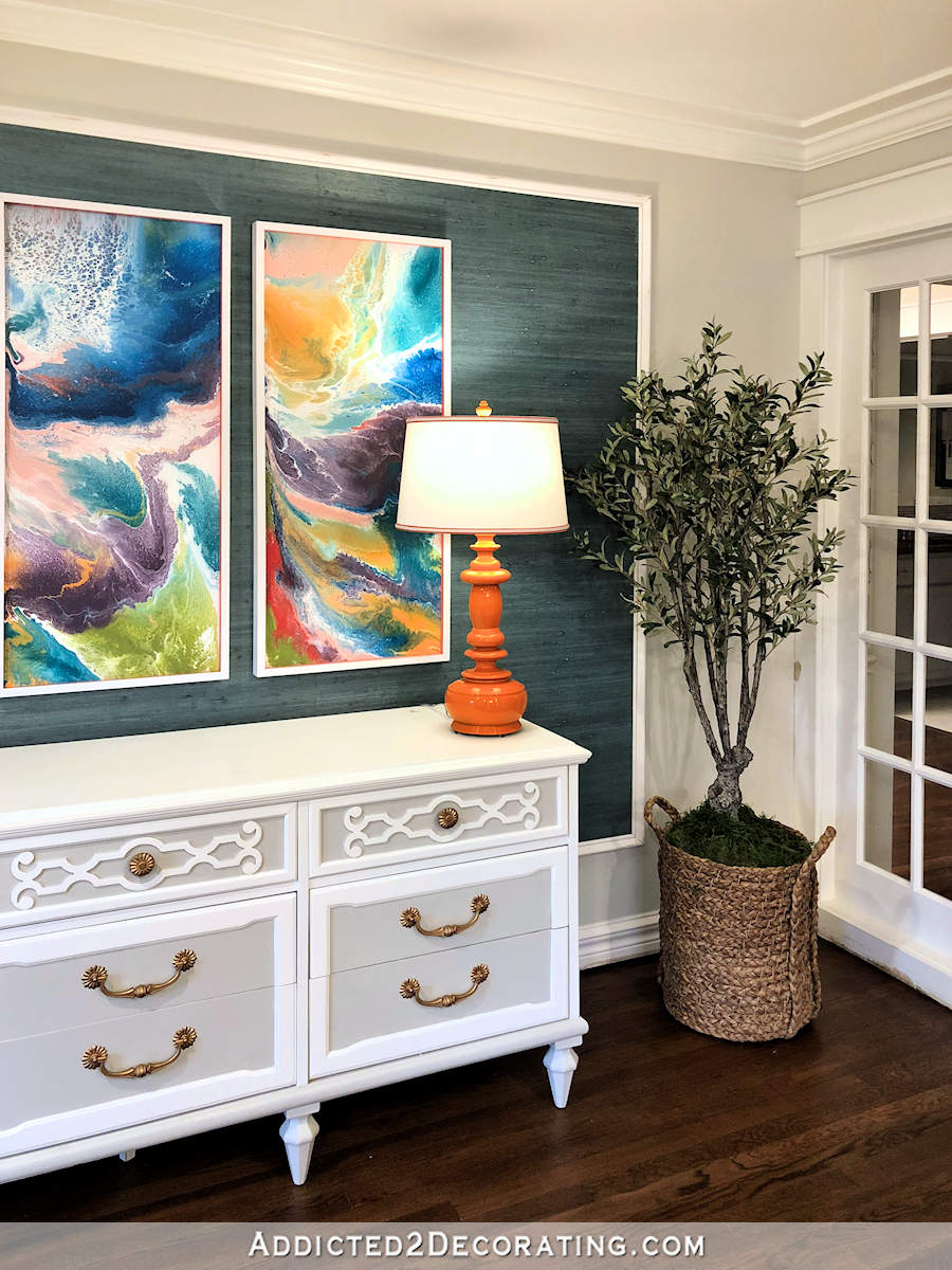 entryway progress - orange lamp - abstract triptych artwork - faux olive tree - teal grasscloth
