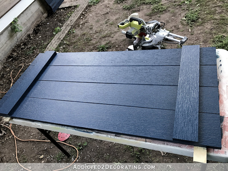 DIY board and batten shutters - paint with exterior paint and add decorative hardware