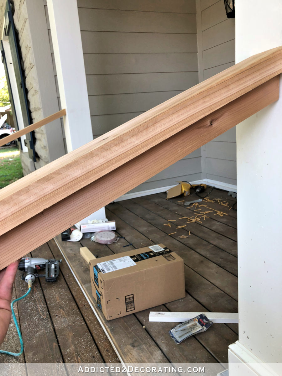 Attaching the vertical bottom board to the handrail.