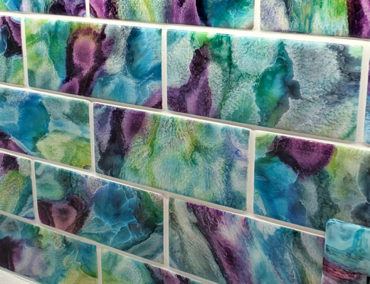 DIY resin and alcohol ink tiles used as a backsplash in pantry