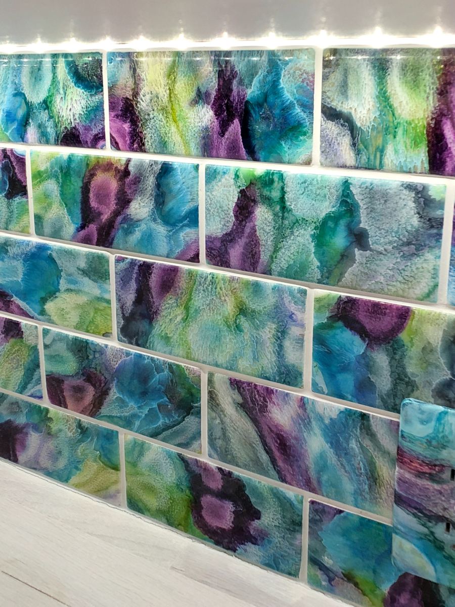 DIY resin and alcohol ink tiles used as a backsplash in pantry