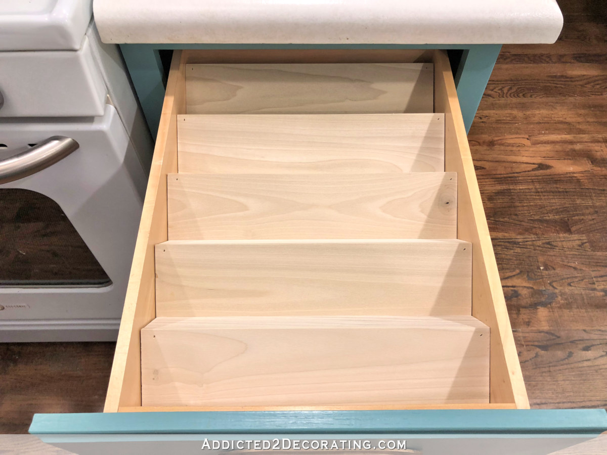 How to make a DIY tiered spice drawer insert - step 6 - place insert into drawer and add spice bottles