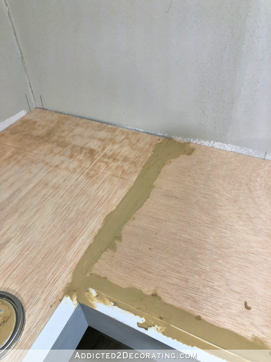 DIY floating corner shelves - fill the cracks with wood filler and then sand