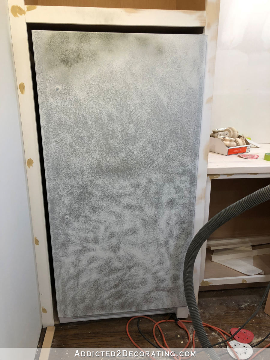 How to paint a refrigerator - sanding a freezer with a textured surface before priming and painting it