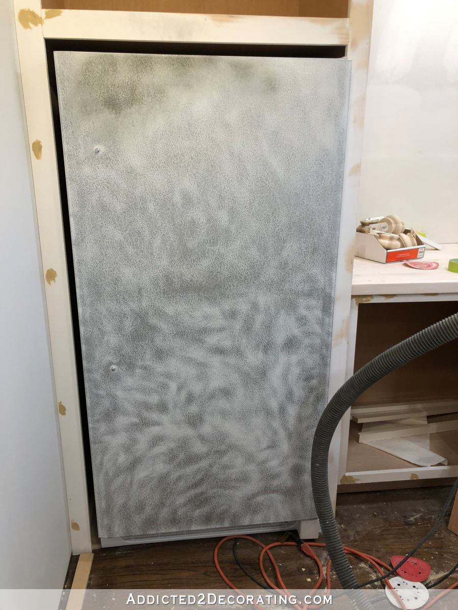 How to paint a refrigerator - sanding a freezer with a textured surface before priming and painting it