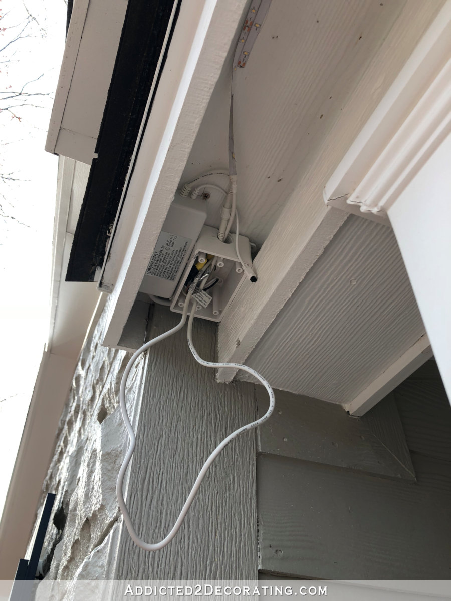 LED tape lights outdoors - installing LED tape lights around front porch roof - excess wire goes into the junction box
