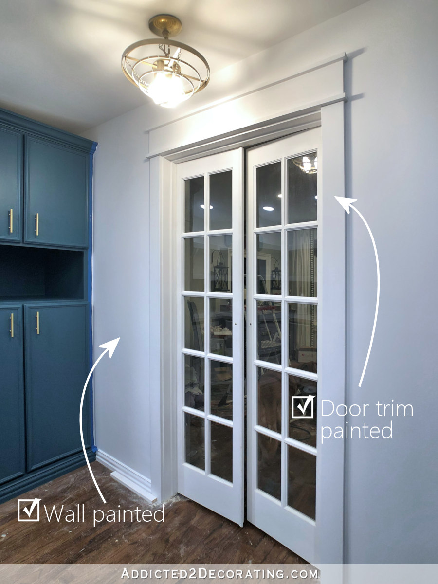 pantry progress - door trim and wall painted