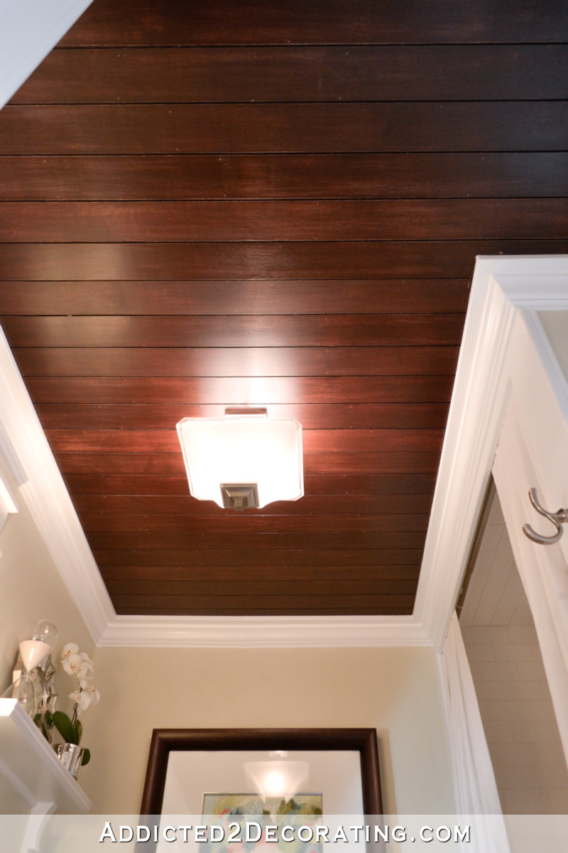 DIY dark stained wood shiplap ceiling in bathroom