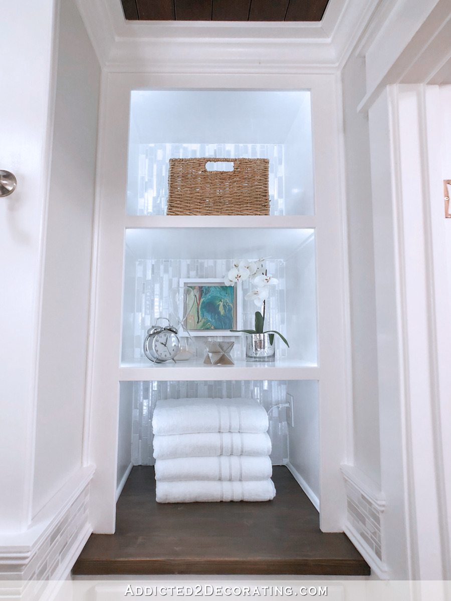 bathroom linen closet turned into open  shelves