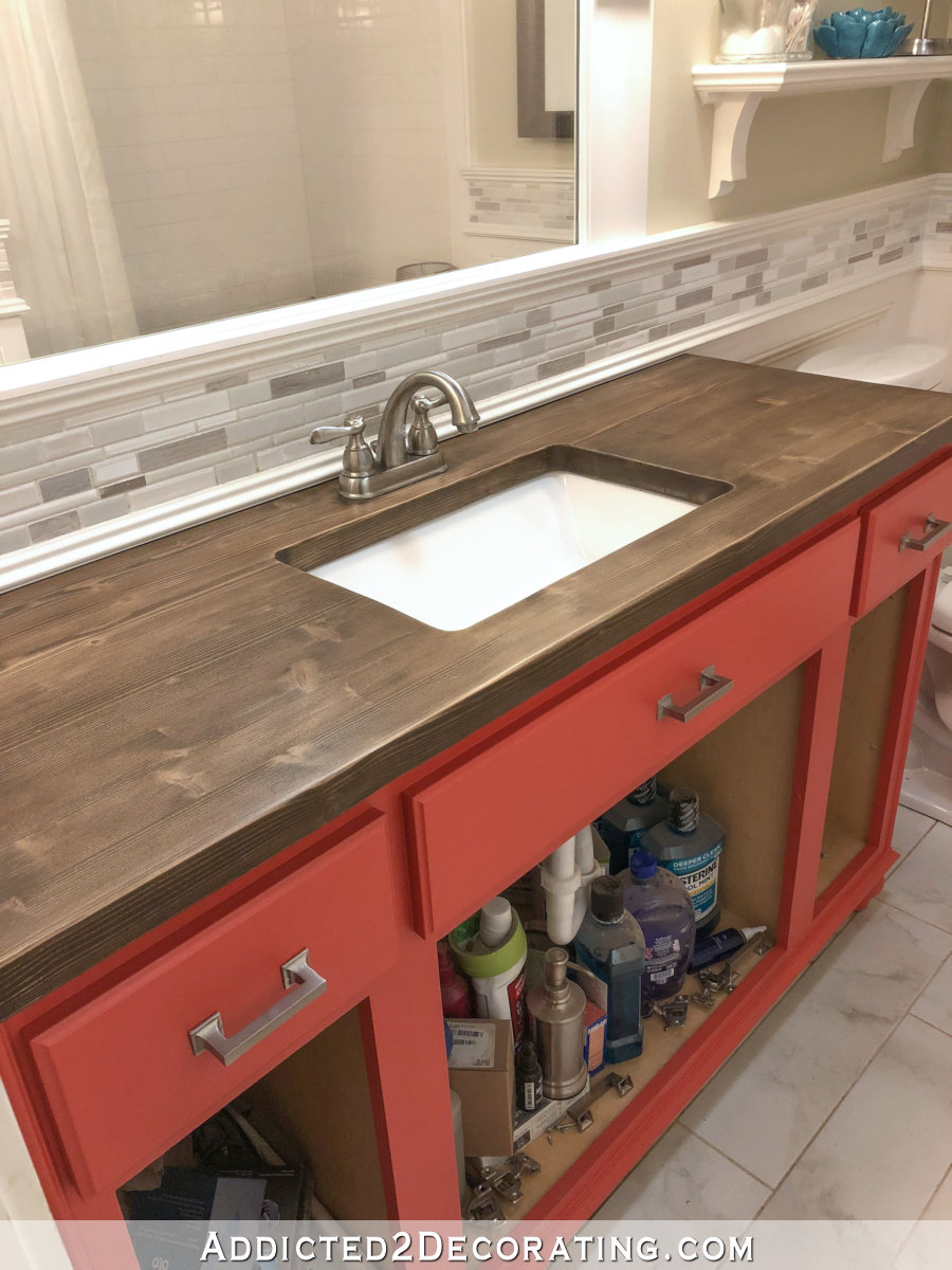 Refinished pine wood countertop with medium tone stain and no yellow or orange undertones.
