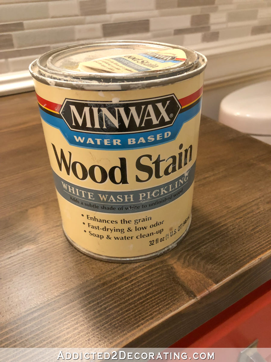 Refinishing a pine wood countertop with dark wiping stain and whitewash pickling stain.