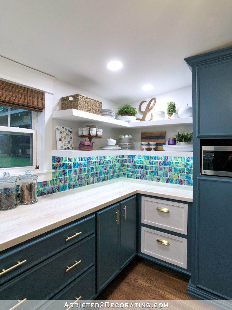 Butler's pantry remodel with dark teal lower cabinets, floating corner shelves, and whitewashed wood countertop