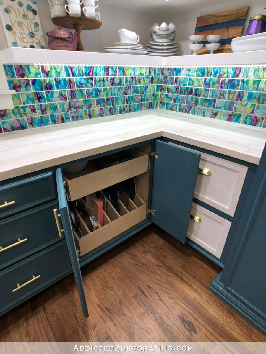 butlers pantry design with lower cabinets with pull out shelves and slotted drawers for bakeware