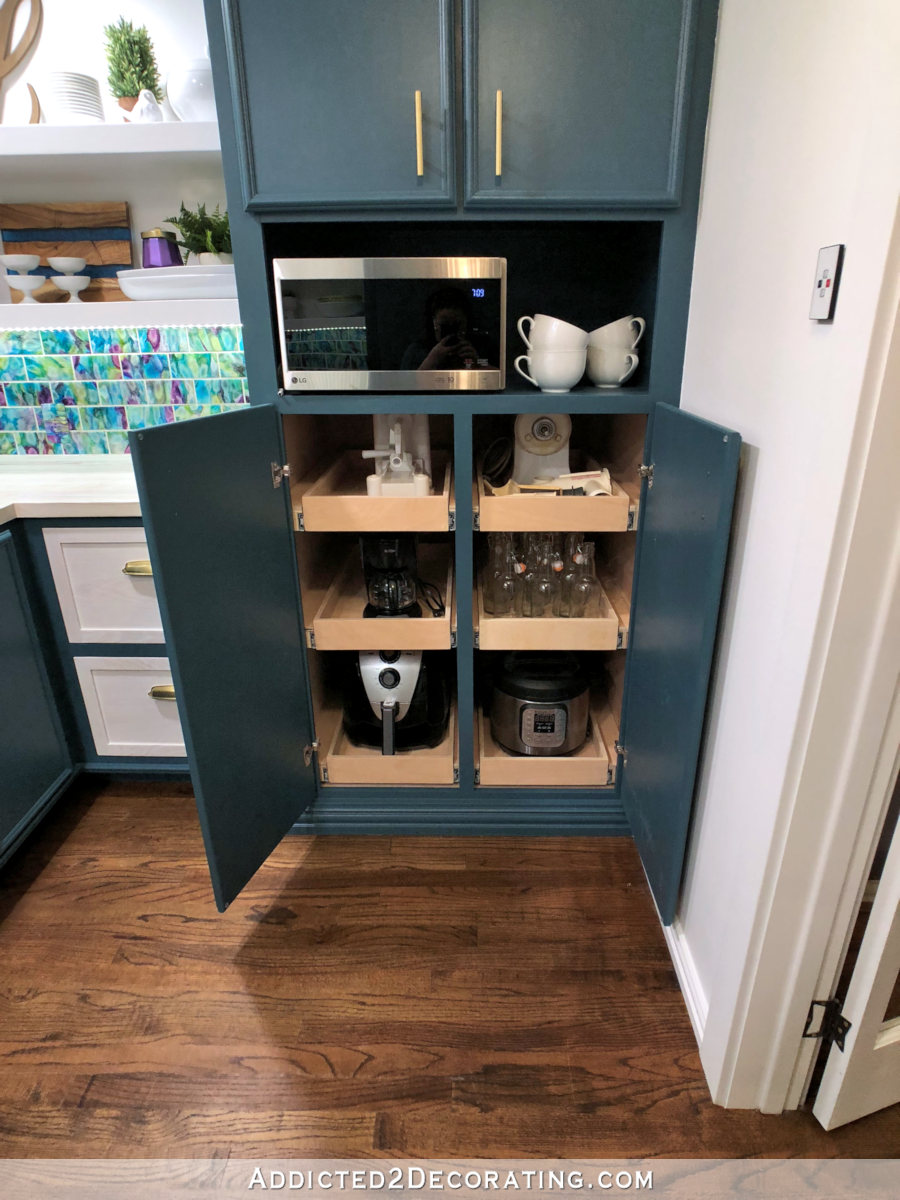 butlers pantry design with pull out shelves in tall corner cabinet
