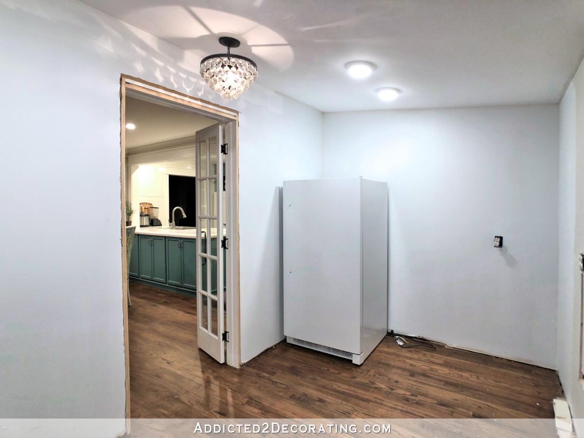 empty walk in pantry with upright freezer