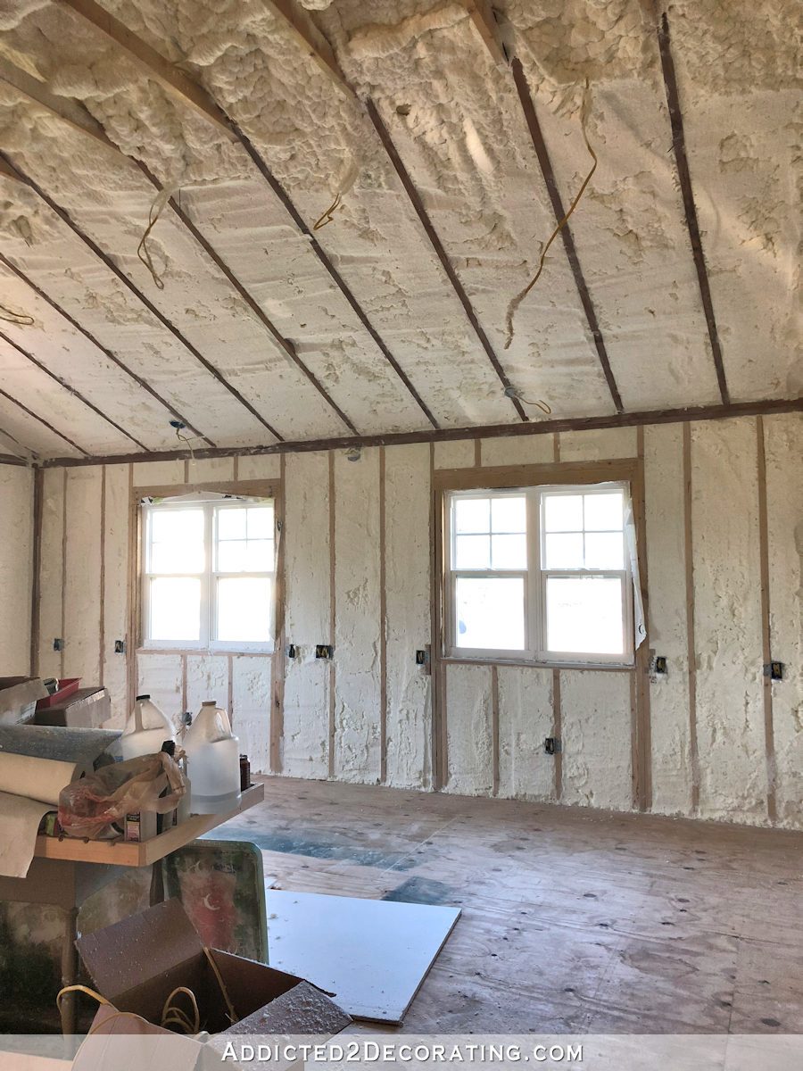 front wall of studio with spray foam insulation in walls