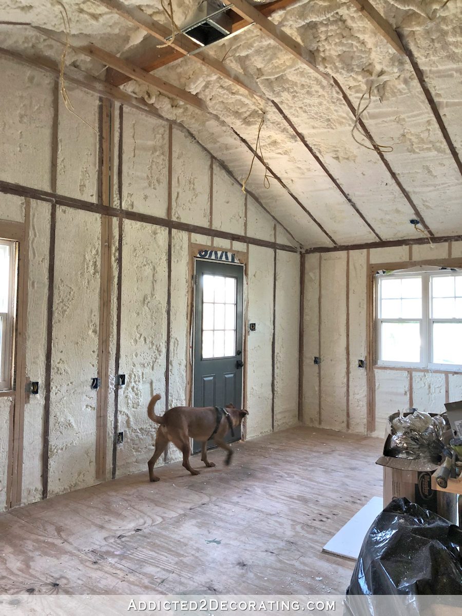 portico side of studio with spray foam insulation in walls and vaulted ceiling
