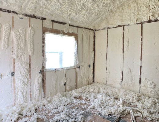 studio during spray foam insulation process - shaved foam from walls covering the floor