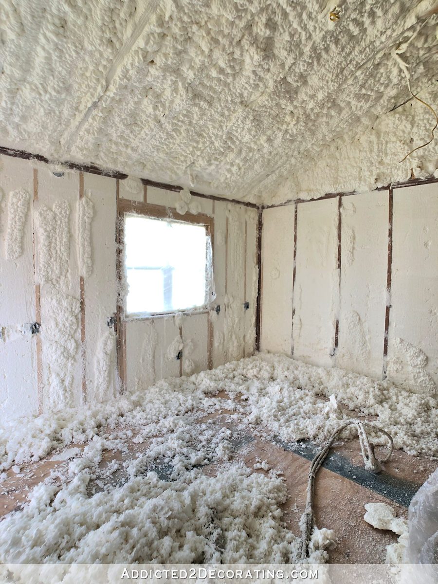 studio during spray foam insulation process - shaved foam from walls covering the floor