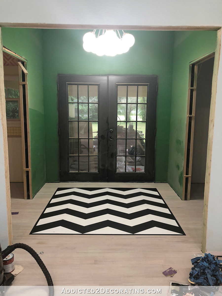 painted black and white chevron floor design - 17