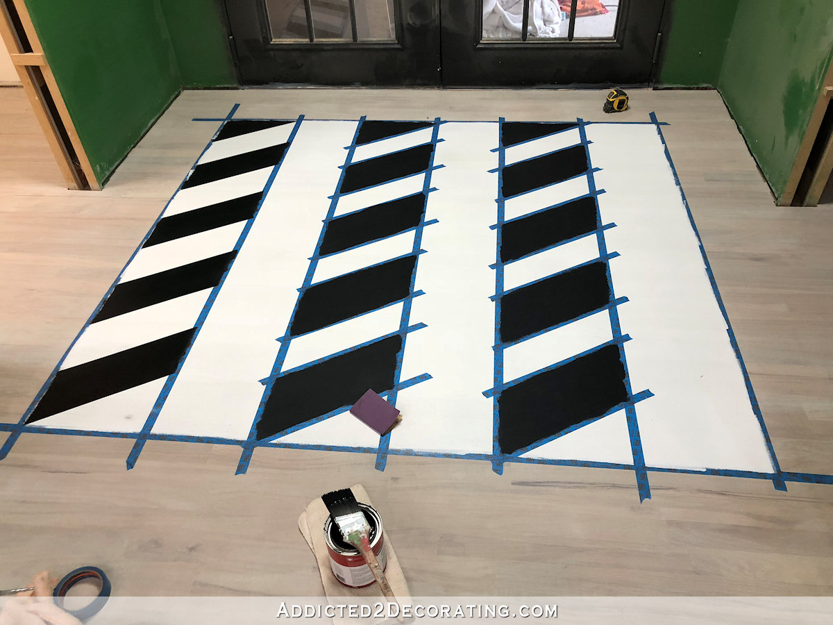 painted black and white chevron floor design - 7