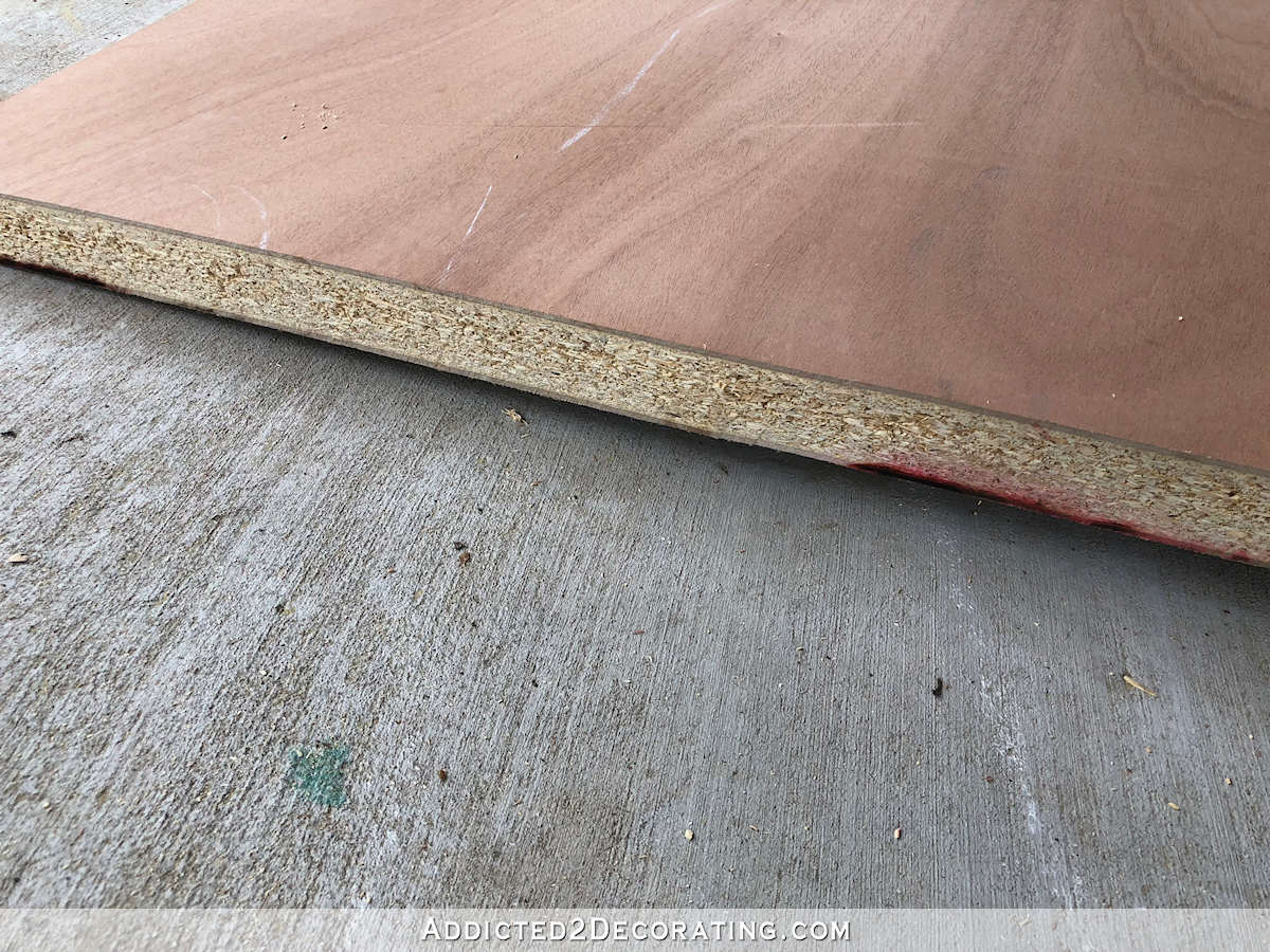 Cut a solid core door down to size using a circular saw to use as a desk top