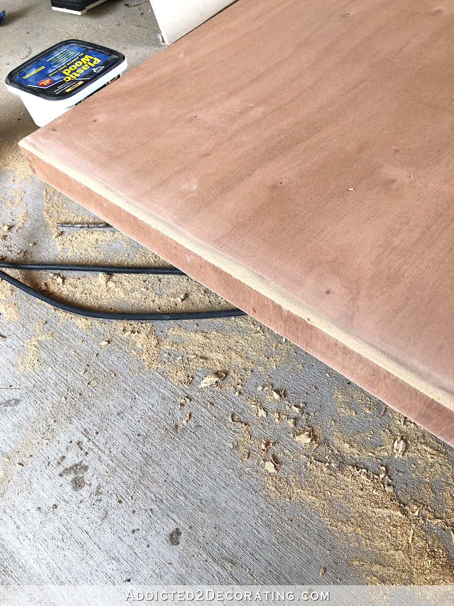 Wood filler sanded smooth on ends of solid core door