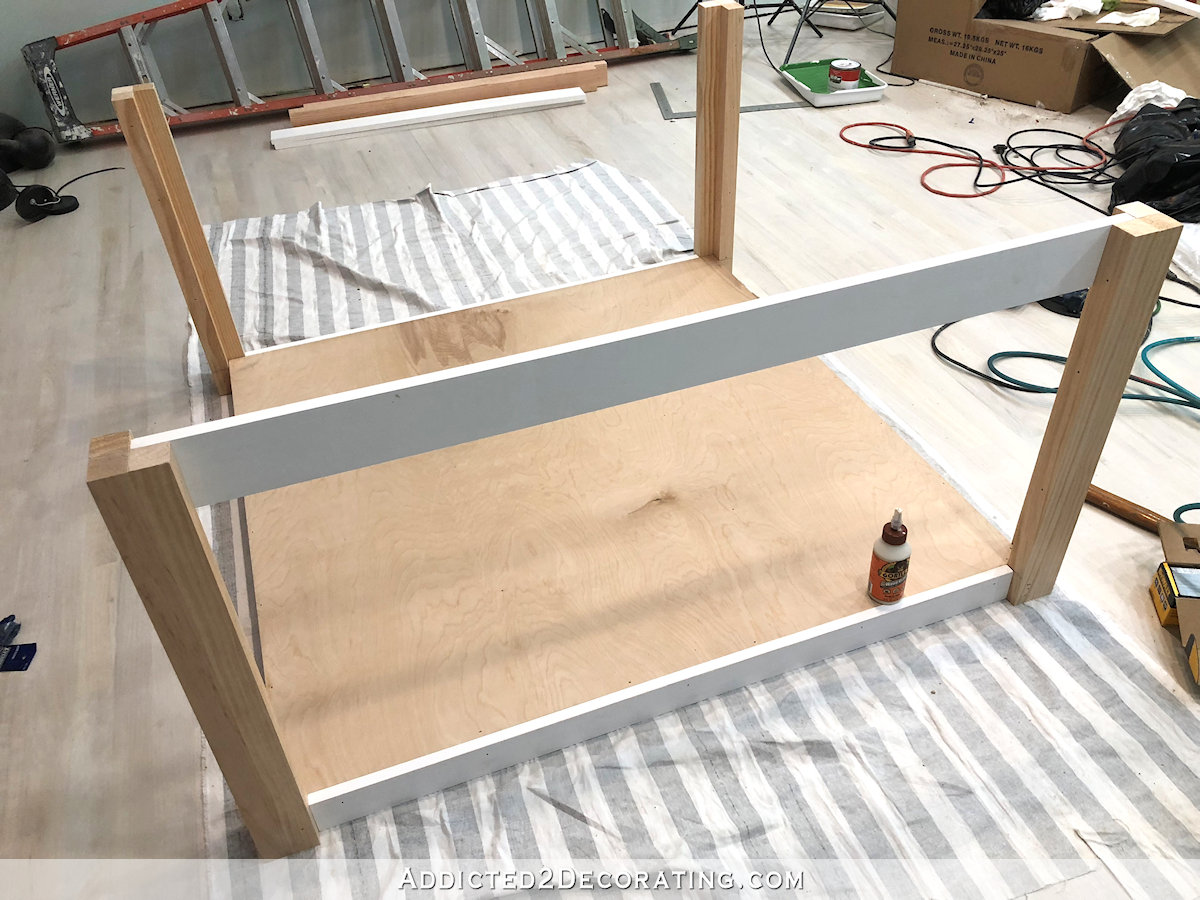 how to build a big craft table - 16 - add edge to bottom shelf