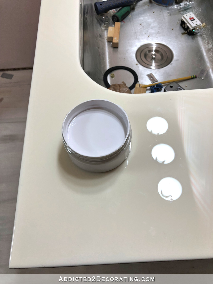 white DIY resin bathroom countertop using Stone Coat Countertop resin - yellowed after two months
