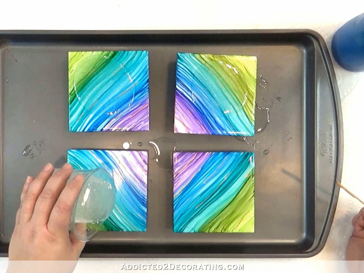 alcohol ink and resin coasters - step 6 - pour resin onto tiles and spread with a stir stick or spatula