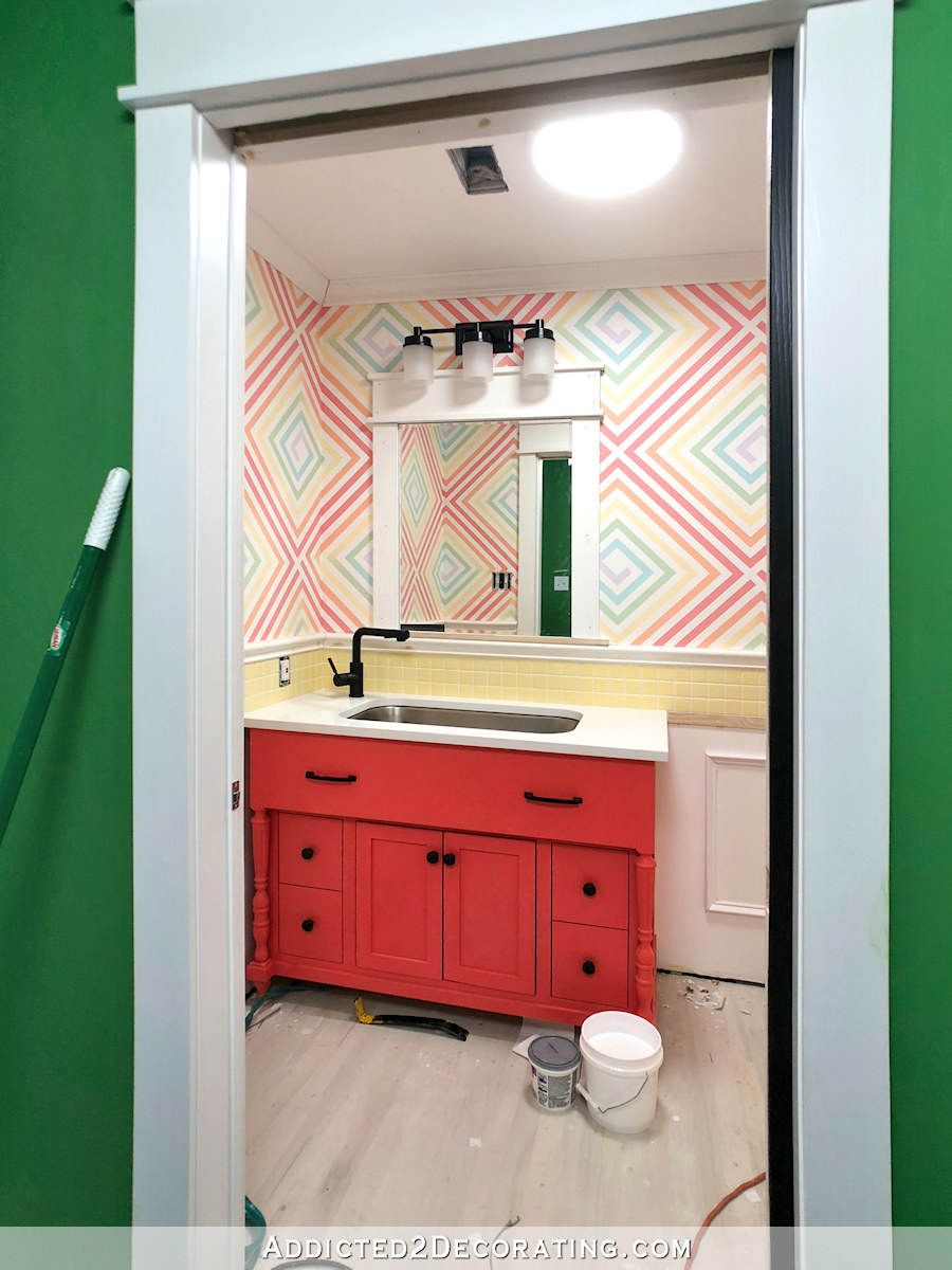 Half bathroom remodel progress -- tile installed and grouted - wainscoting with tile accent