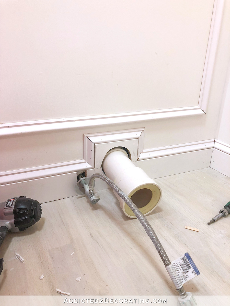 half bathroom walls -- creative trim installation around an ugly pipe