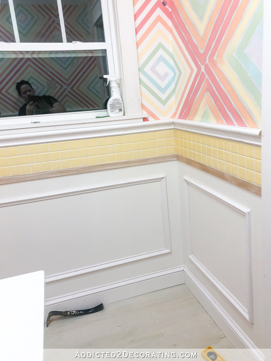 half bathroom walls with picture frame molding installed