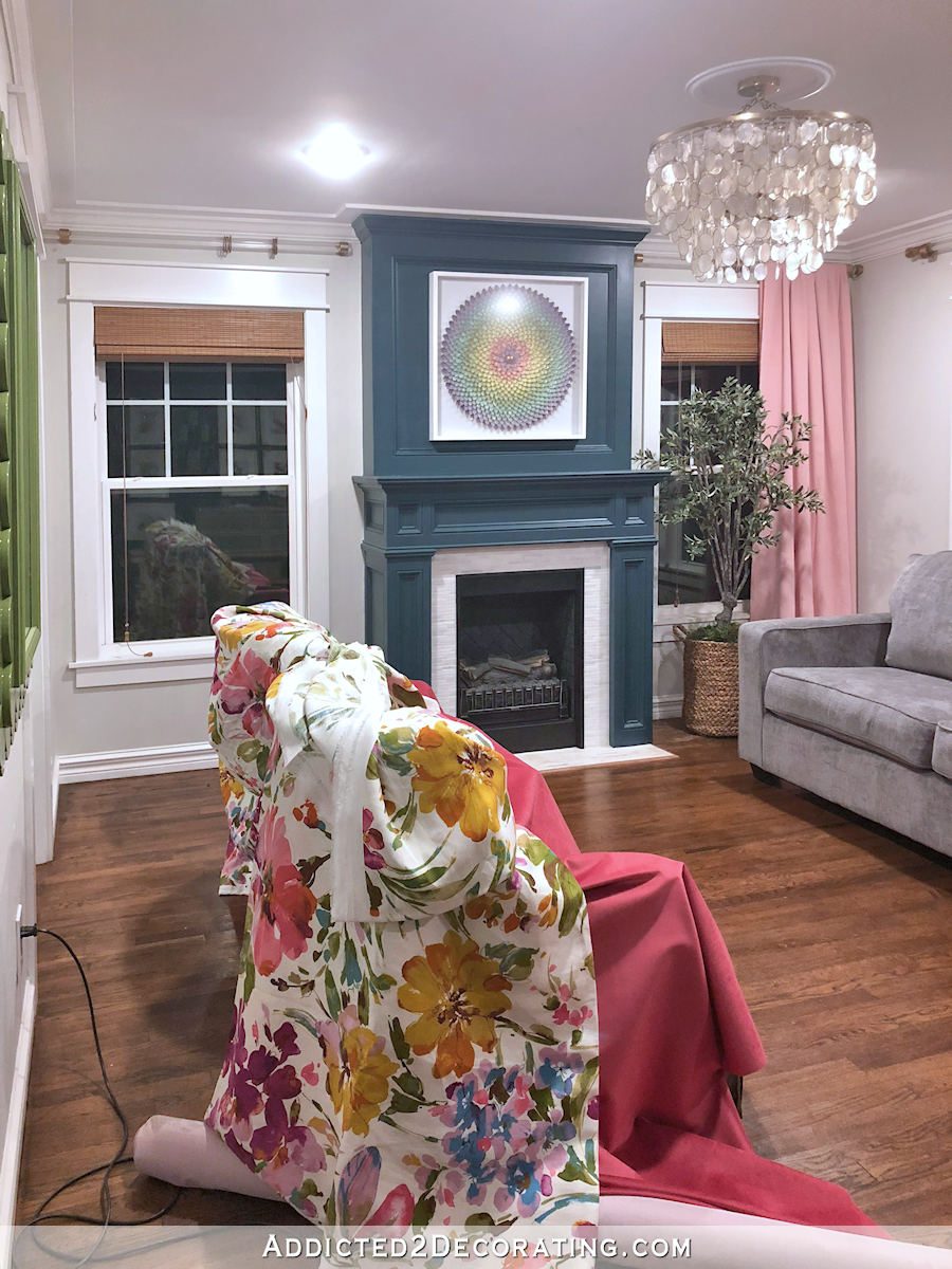 Living room chairs draped with new fabric - raspberry velvet and colorful floral