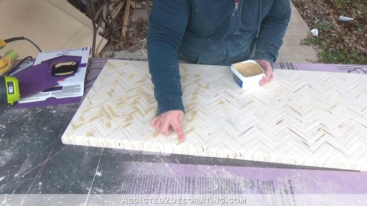 How to build an edge grain plywood herringbone coffee table - step 11 - use wood filler on all of the little voids and cracks