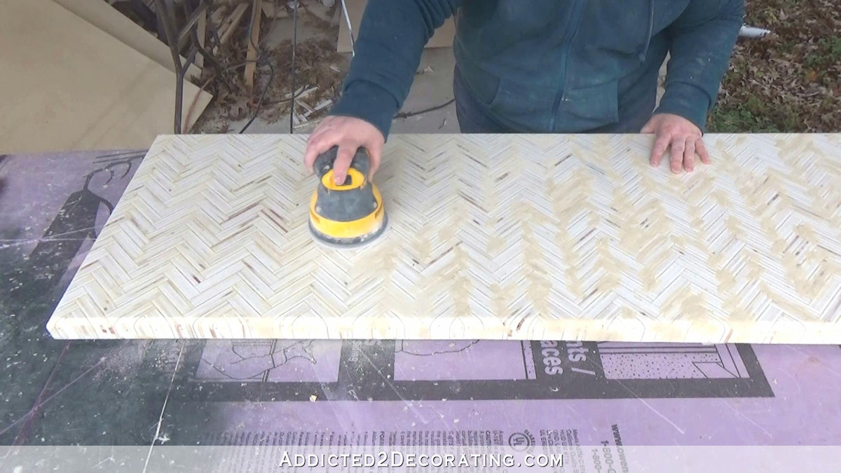 How to build an edge grain plywood herringbone coffee table - step 12 - sand dry wood filler to smooth top