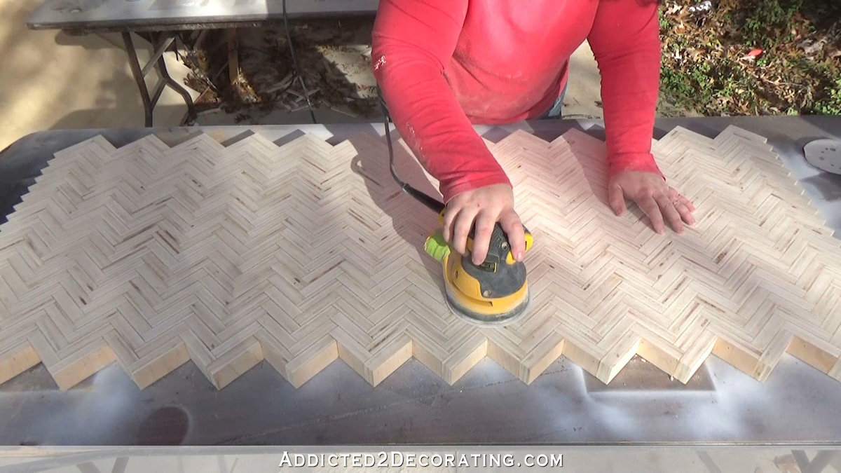 How to build an edge grain plywood herringbone coffee table - step 8 - sand with rotary sander