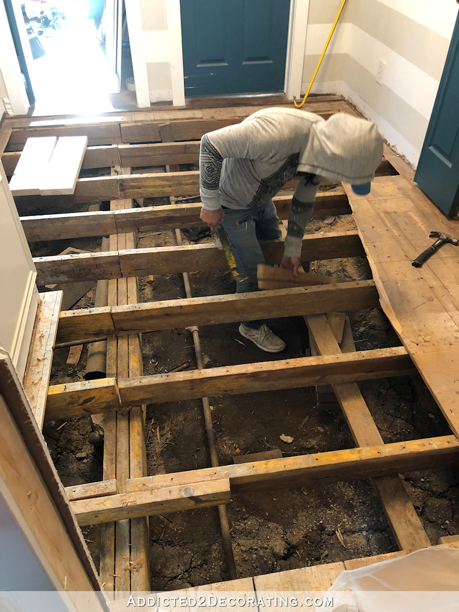 removing hallway hardwood flooring and subfloor due to water damage