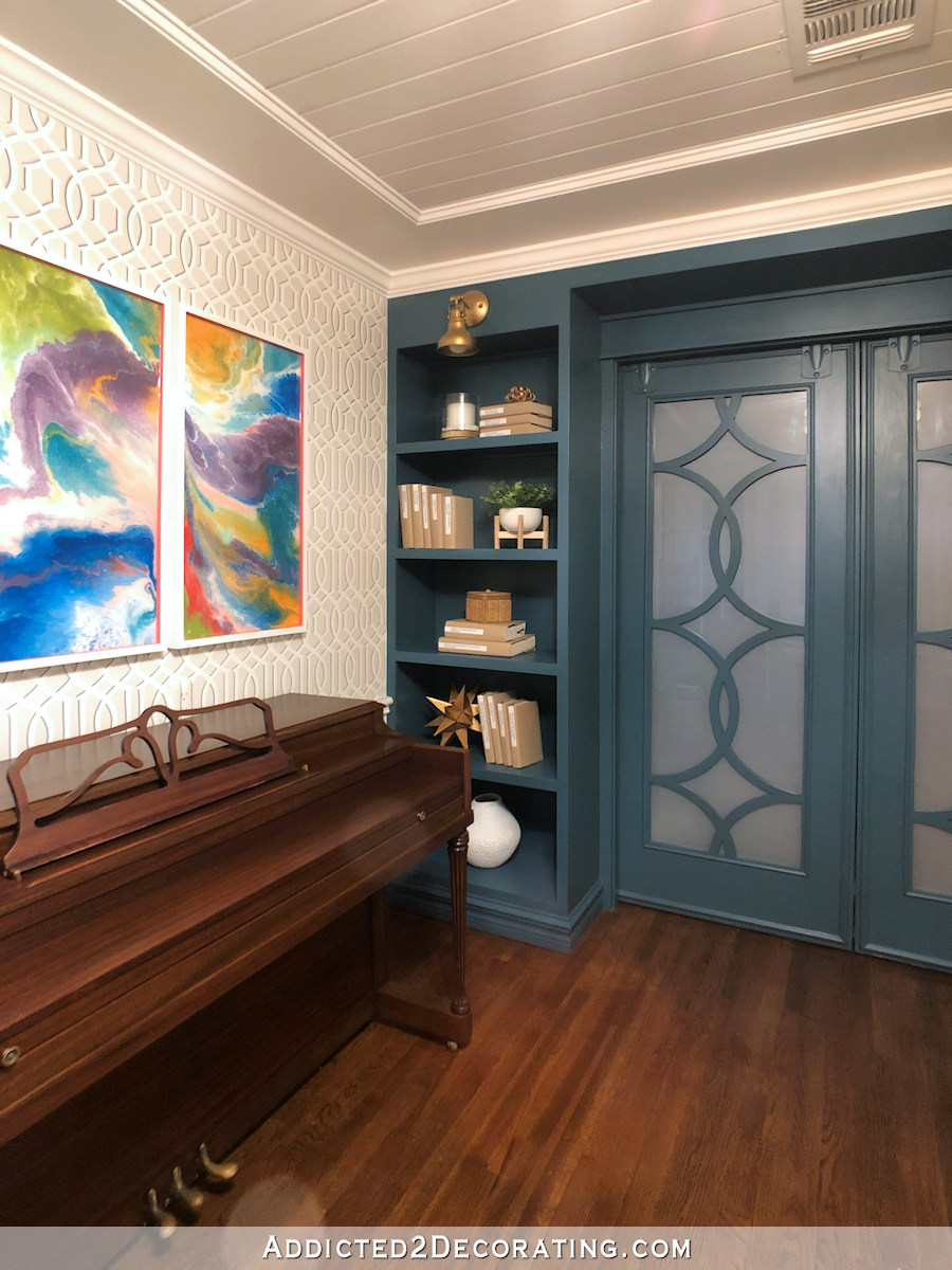 music room with teal bookcases - 2
