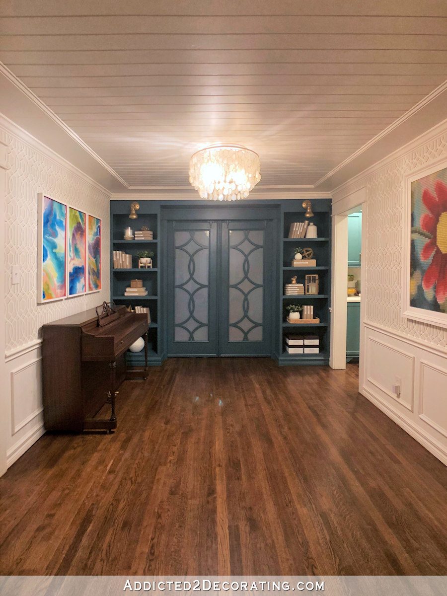 music room with teal bookcases - 3