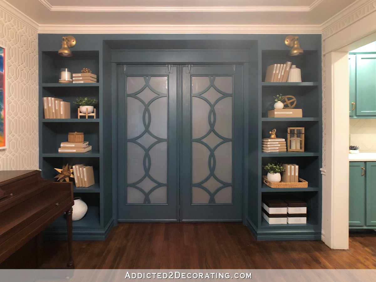 music room with teal bookcases - 6