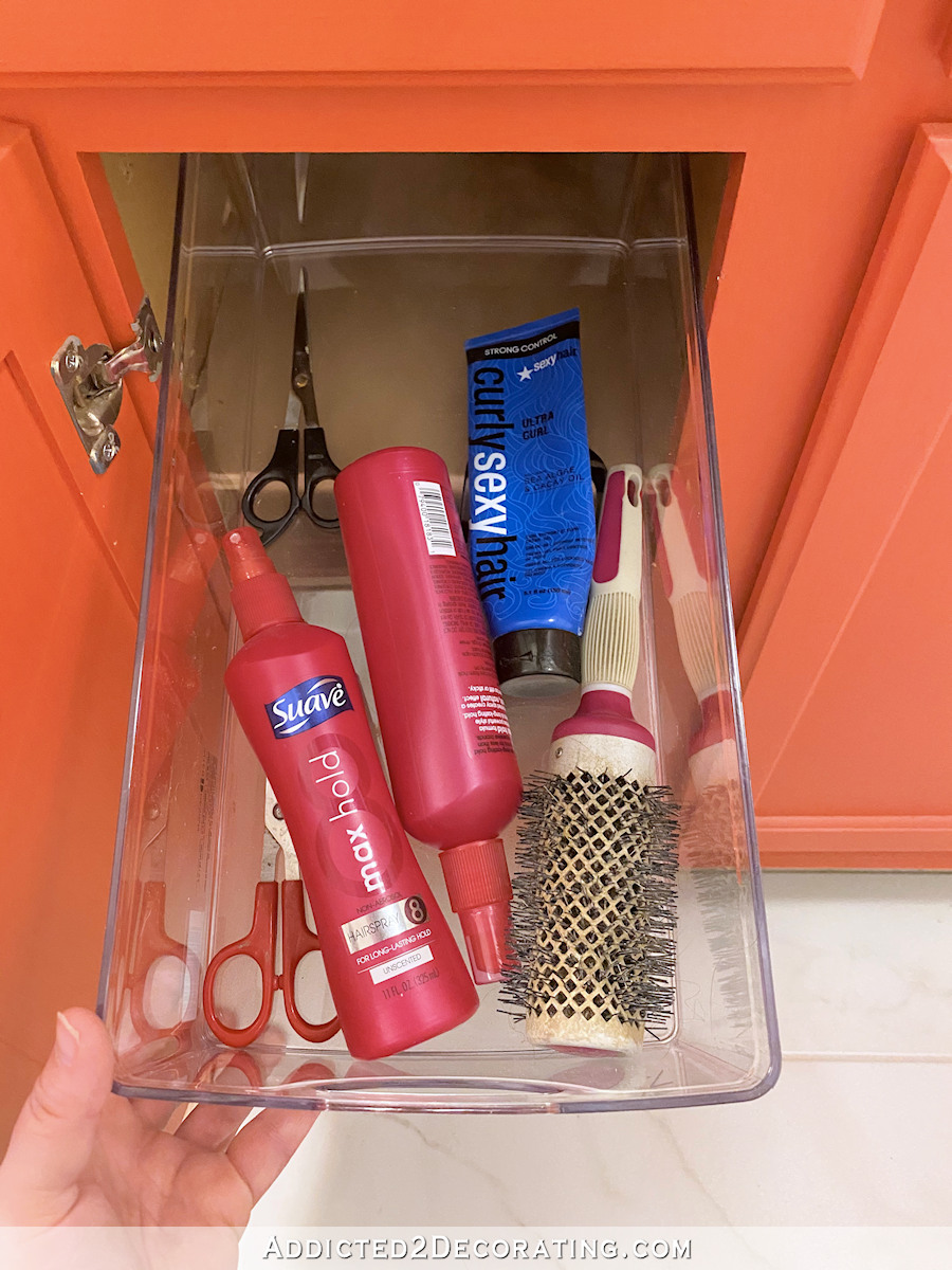 bathroom vanity organization - left cabinet after - top shelf