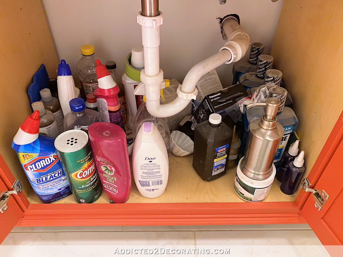 bathroom vanity organization - middle cabinet before