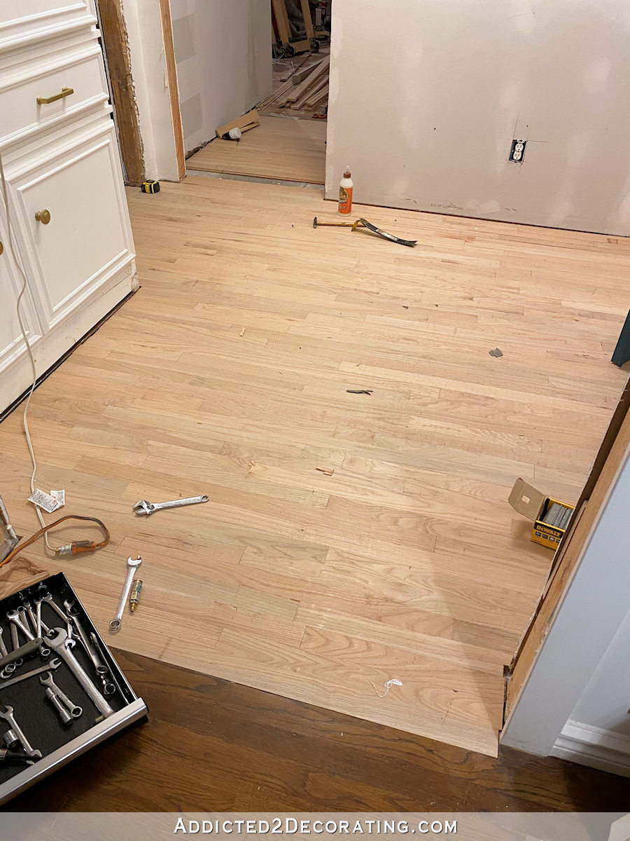 hallway hardwood flooring installation -- hallway flooring had to be replaced due to water damage