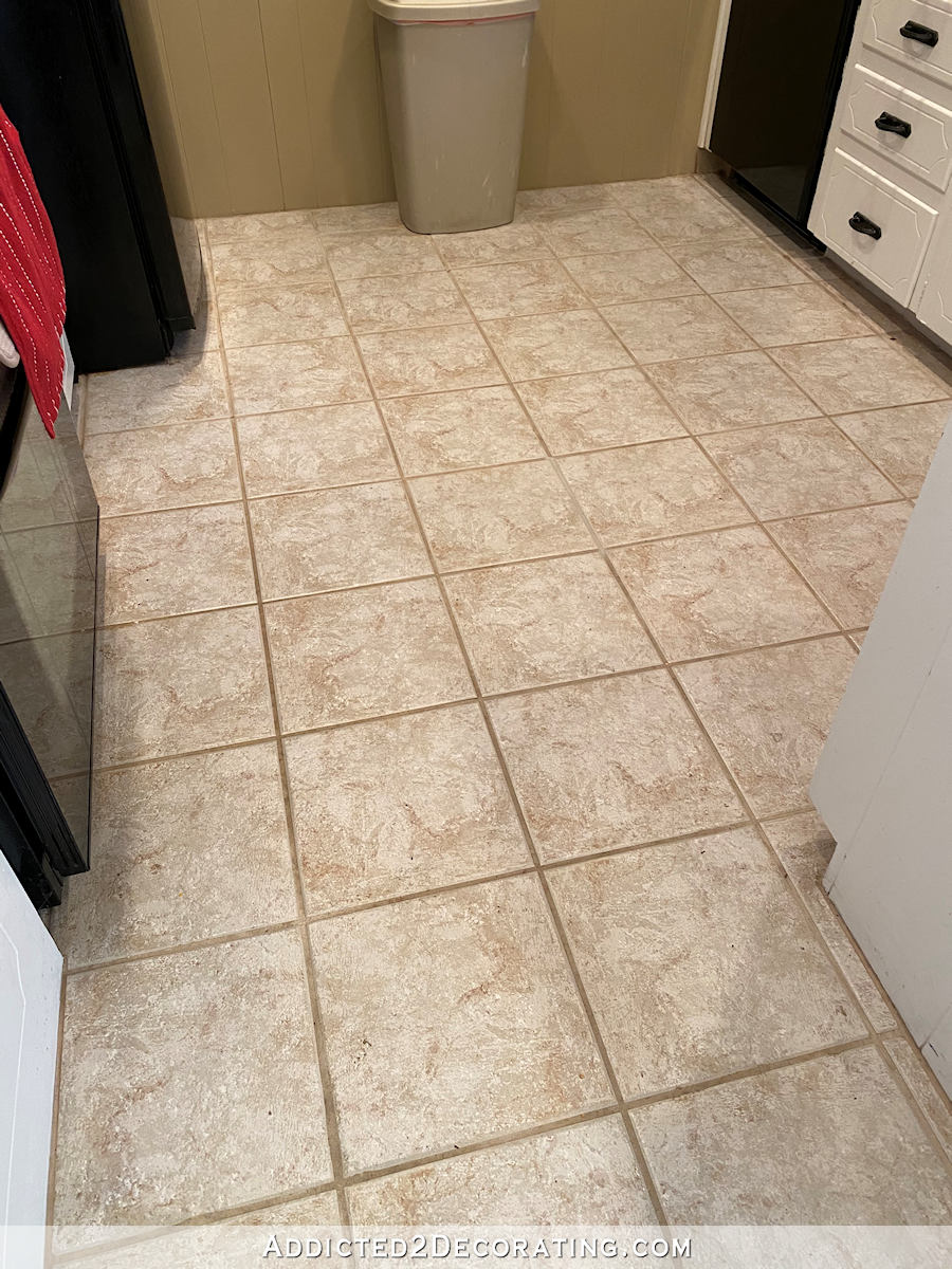 mom's kitchen floor - tile grout before using Grout Renew