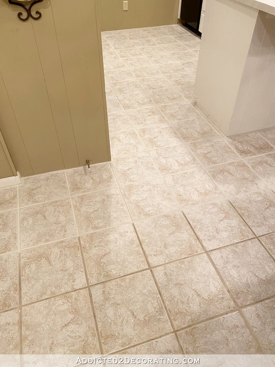 mom's kitchen floor - tile grout comparing before and after Grout Renew