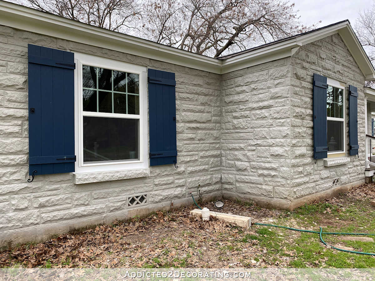 window removed and filled in with stone