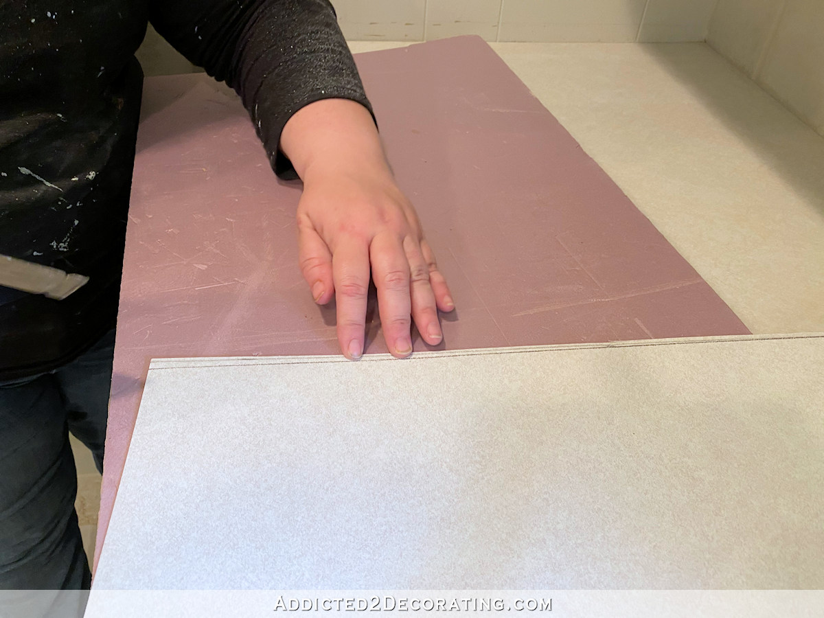 diy countertop - installing new laiminate over old - use dremel multi max to cut scribed line