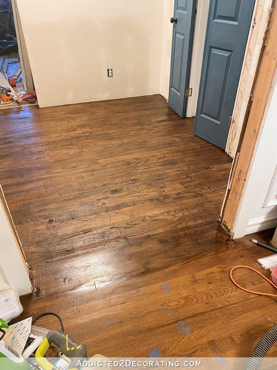 hallway hardwood floor refinishing fail -- the floor colors don't match